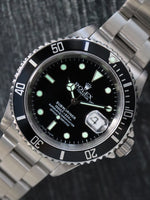 40311 : Rolex Submariner 40, Ref. 16610, Box and Papers Circa 2002